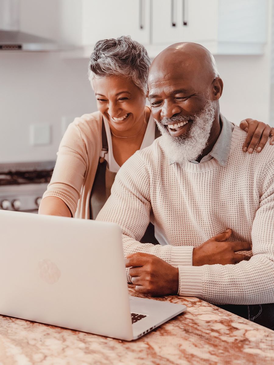 husband and wife at a computer