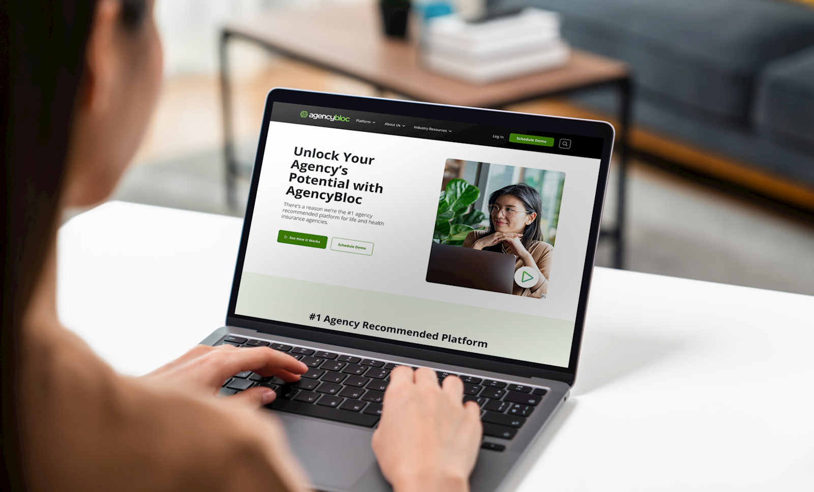 woman navigating Agencybloc website on her laptop