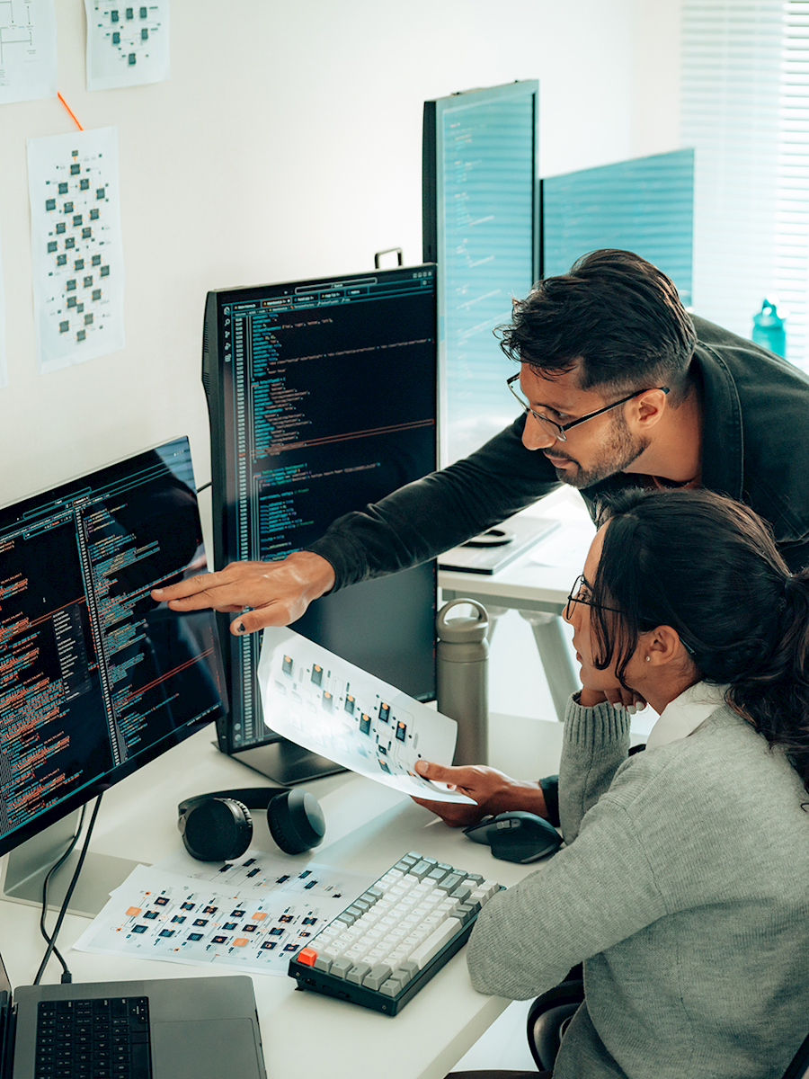 man and woman reviewing code